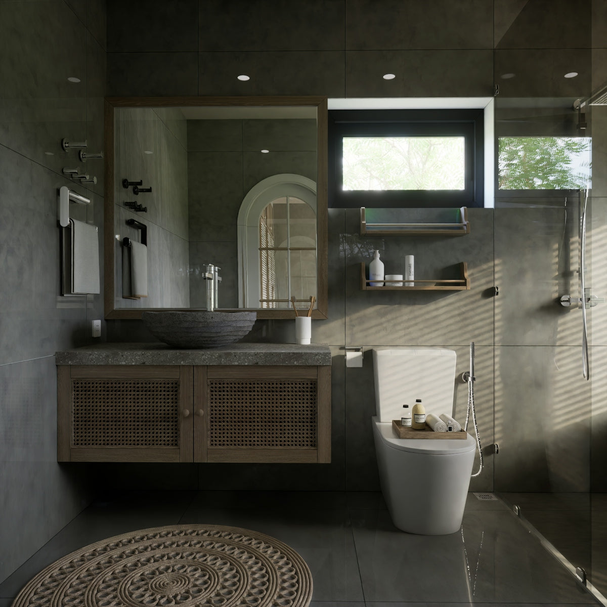 a bathroom with a toilet, sink, and mirror