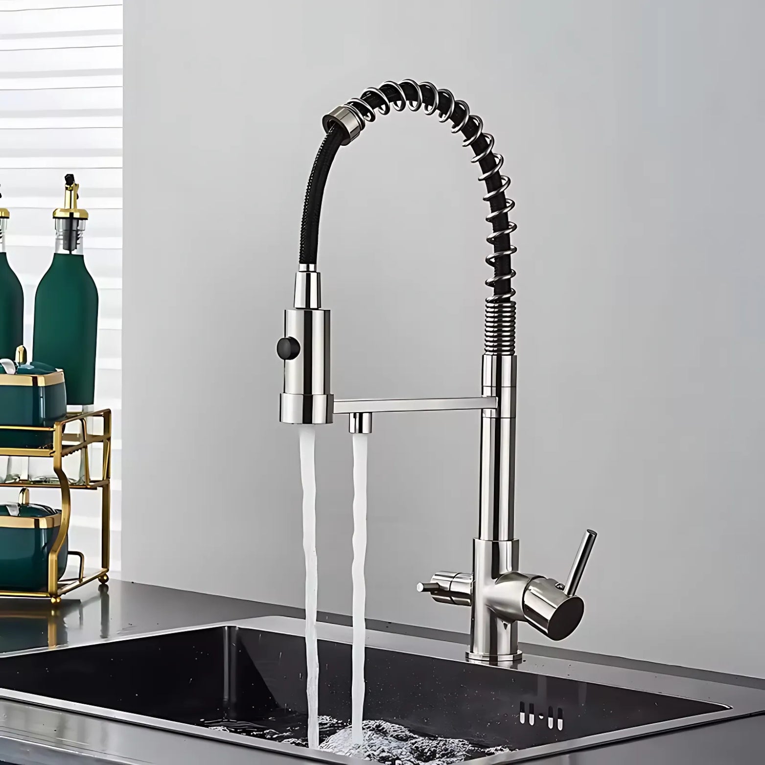 Modern kitchen faucet with water flowing into a sink against a neutral background