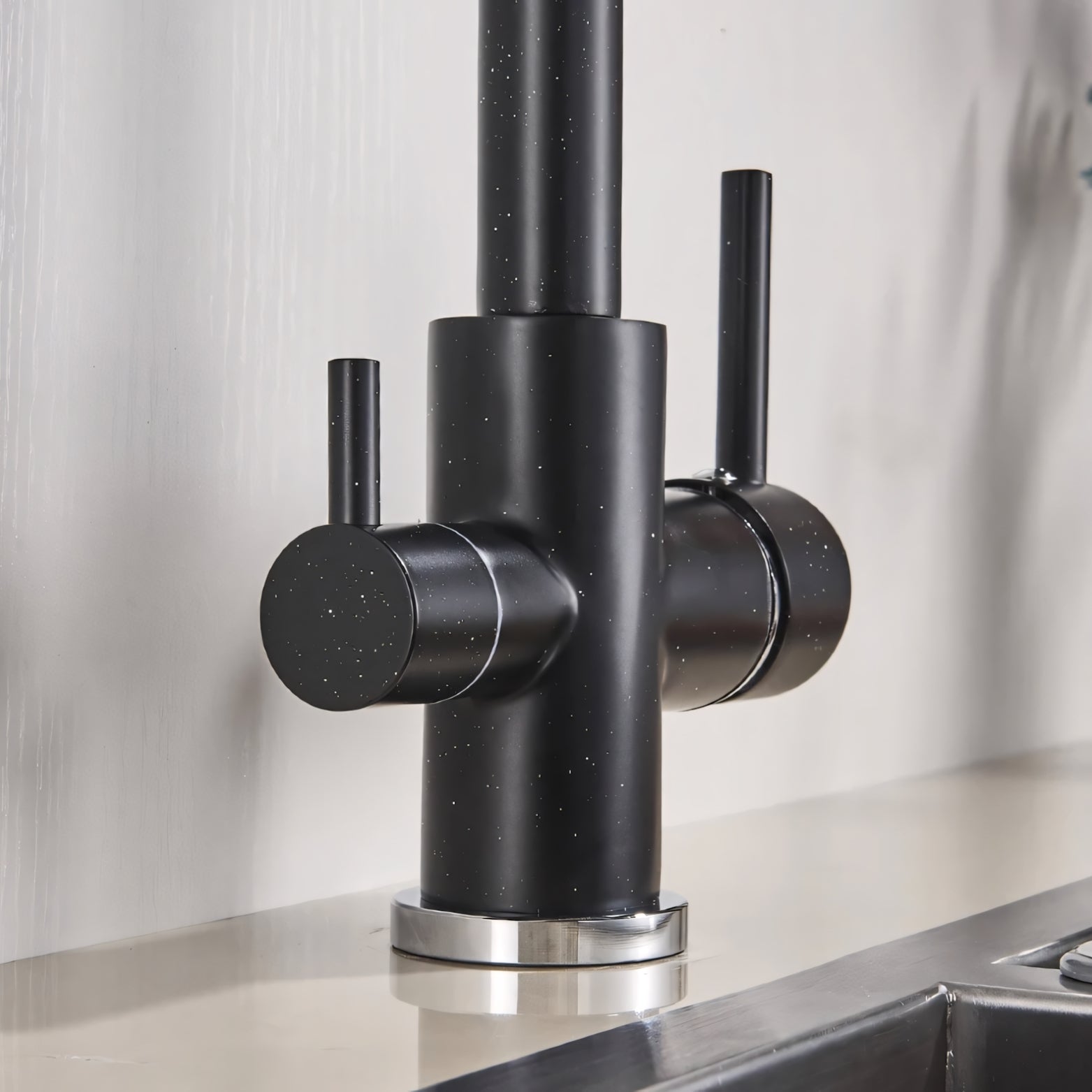 Black kitchen faucet with a metallic finish on a neutral background