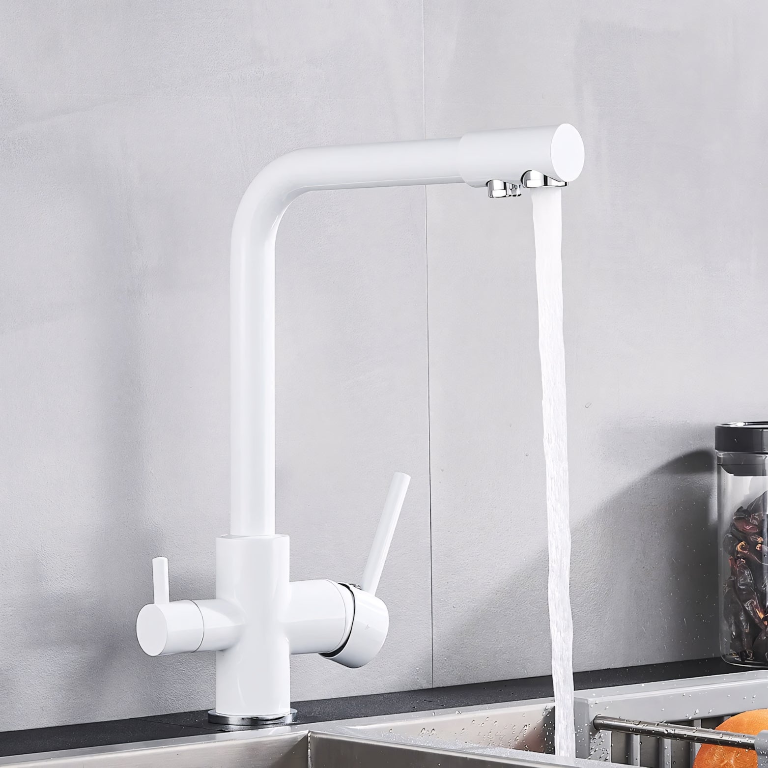 White kitchen faucet with water flowing in a modern kitchen setting.