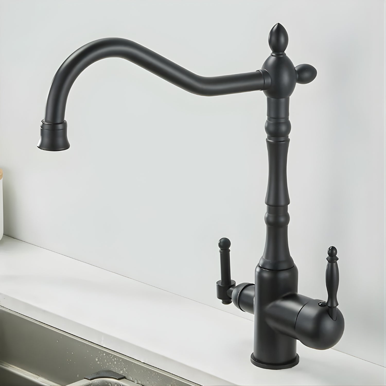 Black kitchen faucet with a white background