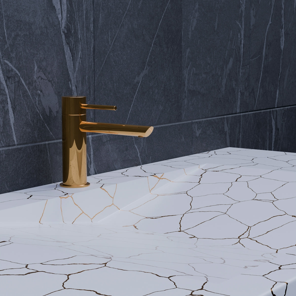 A bathroom sink with a gold faucet and marble counter top