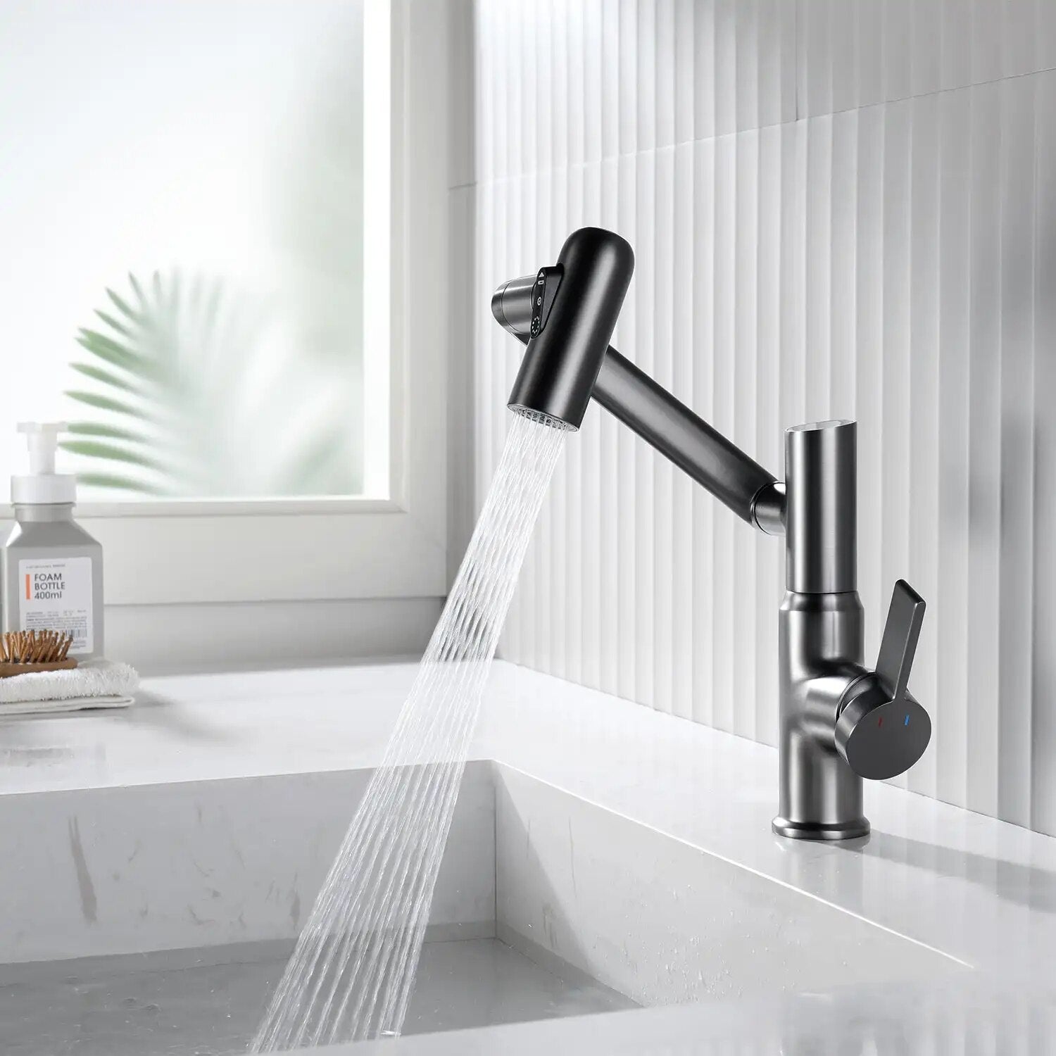 Gray Leiden faucet in a luxurious bathroom splashing water